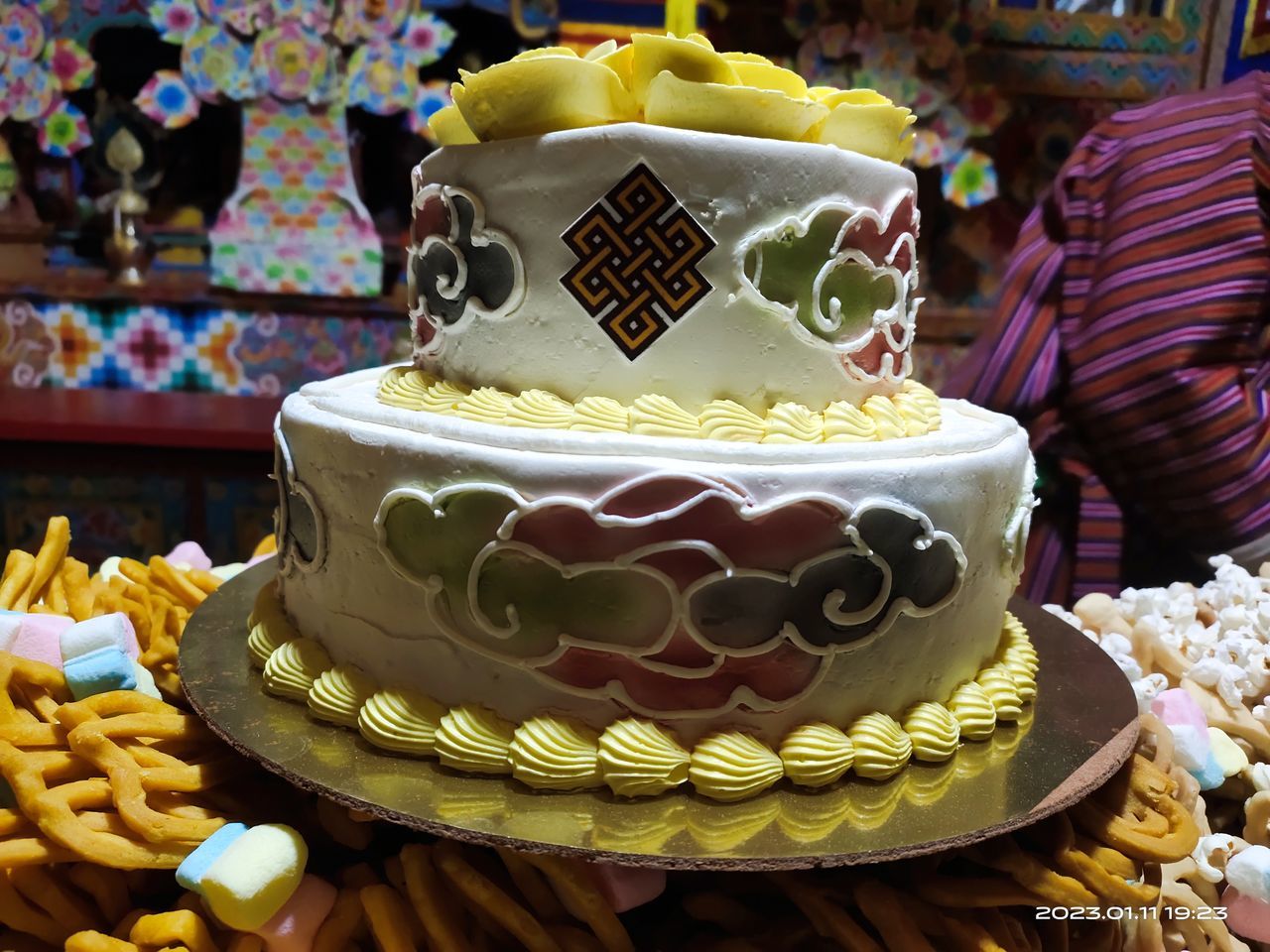 food, birthday cake, dessert, sweet food, sweet, food and drink, cake, icing, wedding cake, baked, celebration, religion, event, cake decorating, belief, tradition, yellow, no people, sweetness, indoors, focus on foreground