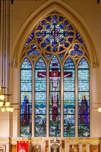 Low angle view of glass window in building