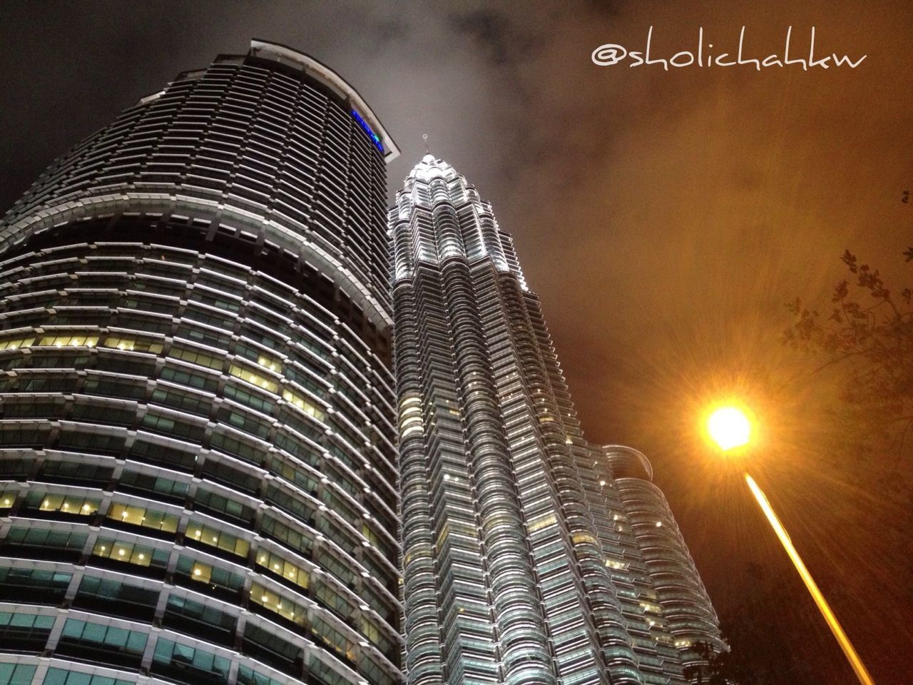 architecture, building exterior, built structure, illuminated, city, skyscraper, modern, night, tall - high, tower, low angle view, office building, capital cities, travel destinations, famous place, building, travel, no people, city life, international landmark