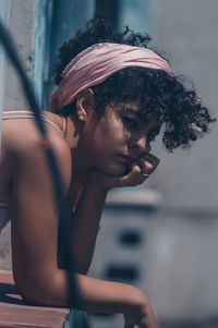 Portrait of young woman looking away