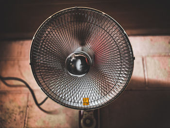 Close-up of electric lamp on wall