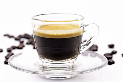 Close-up of coffee cup against white background