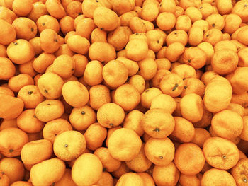 Full frame shot of oranges at market stall