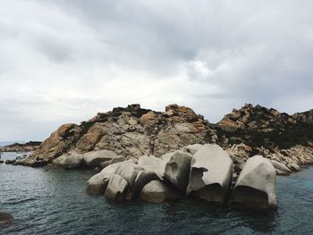 Scenic view of sea and rocks against sky