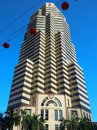 Low angle view of buildings against blue sky