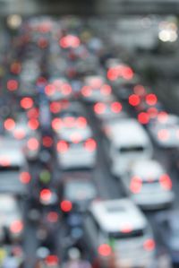 Defocused image of traffic on road at night