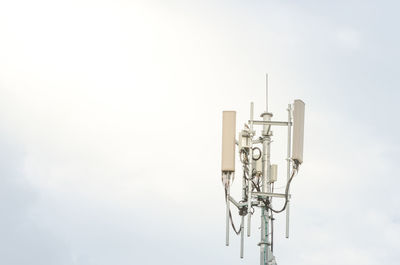 Low angle view of communications tower against sky