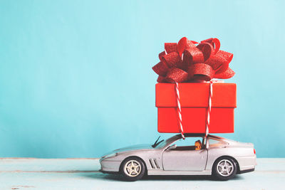 Close-up of toy car against blue background