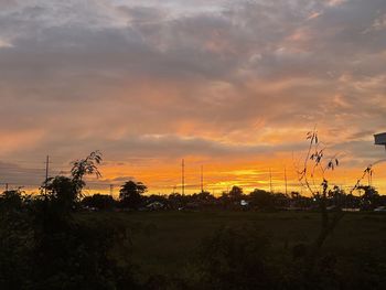 Scenic view of field against sky during sunset