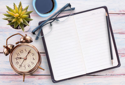 High angle view of clock on table at home