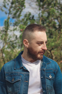 Portrait of young man looking away