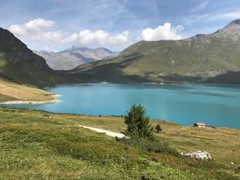 Scenic view of lake and mountains against sky