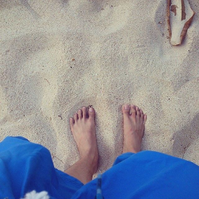 low section, person, sand, beach, personal perspective, high angle view, lifestyles, human foot, barefoot, leisure activity, standing, shore, men, relaxation, day, part of