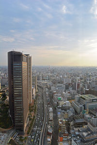 High angle view of modern buildings in city against sky