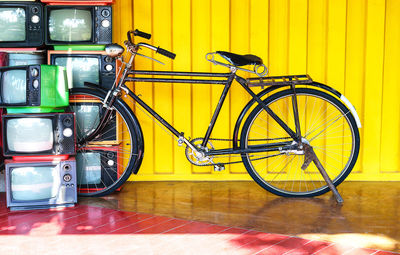 Bicycle parked against wall