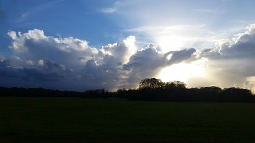 Scenic view of landscape against cloudy sky