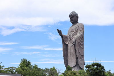 Low angle view of statue against sky