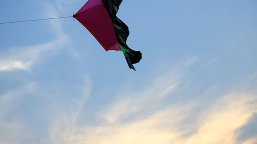 Low angle view of flag against sky