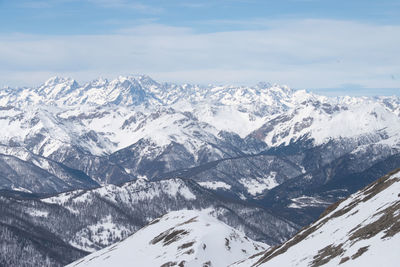 Scenic view of snowcapped mountains against sky