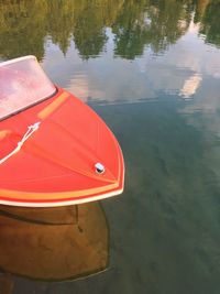 Boats moored in lake