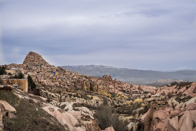 Scenic view of mountain against cloudy sky