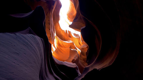 Close-up of fire on rock at night