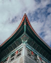 Low angle view of illuminated building against sky