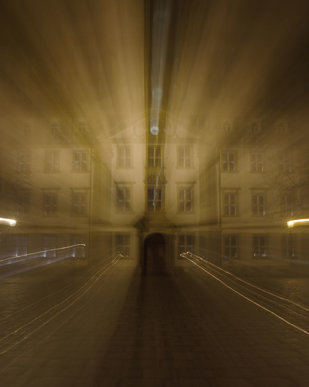 BLURRED MOTION OF TRAIN AT ILLUMINATED SUBWAY STATION