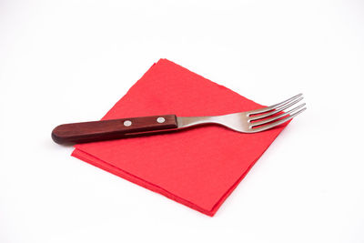 High angle view of red flag against white background