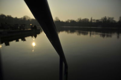 Scenic view of calm lake at sunset