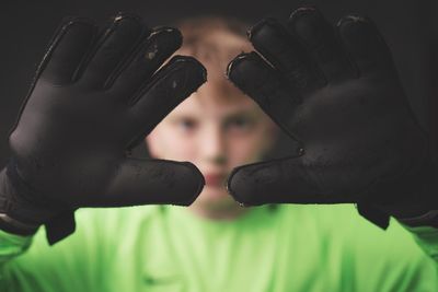 Close-up portrait of boy gesturing 