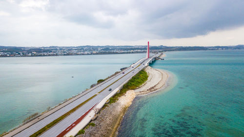Scenic view of sea against sky in city