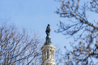 Low angle view of statue against sky