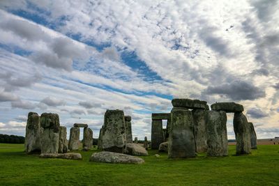 Scenic view of stonehenge against cloudy sky