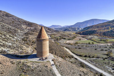 Scenic view of mountains against clear blue sky