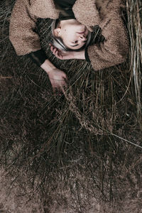 Upside down image of woman lying on grass