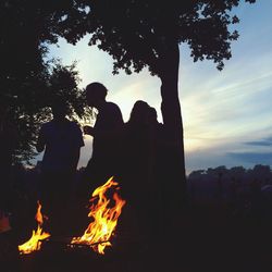 Silhouette of people at night