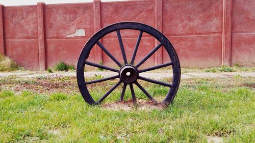 Abandoned wheel on field