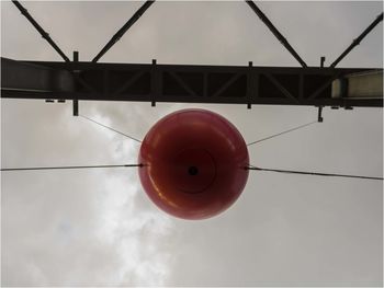 Low angle view of telephone pole against sky