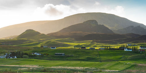 Scenic view of landscape and mountains against sky