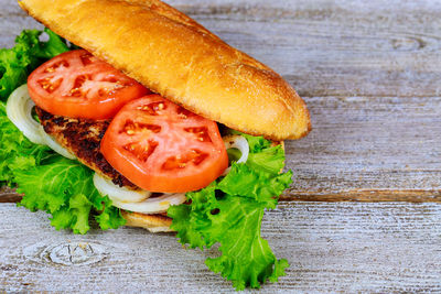 Close-up of burger on wooden table