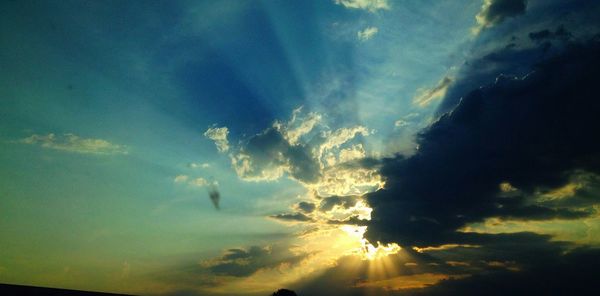 Low angle view of cloudy sky at sunset