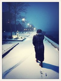 People walking on snow covered road