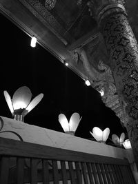 Low angle view of illuminated lighting equipment