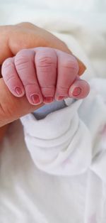 Close-up of woman holding hand