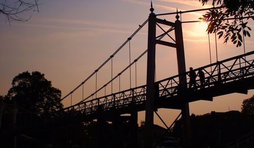 Silhouette of bridge against sky