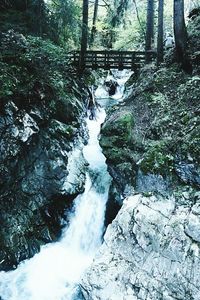 Scenic view of waterfall against sky