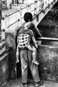 Rear view of woman standing in park