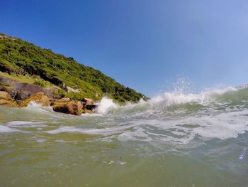 Scenic view of sea against clear blue sky