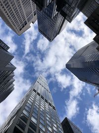 Low angle view of modern buildings against sky